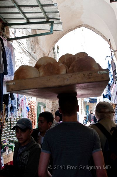 20100408_111406 D3.jpg - Man carrying loaves of bread on head, Islamic Quarter, Old City